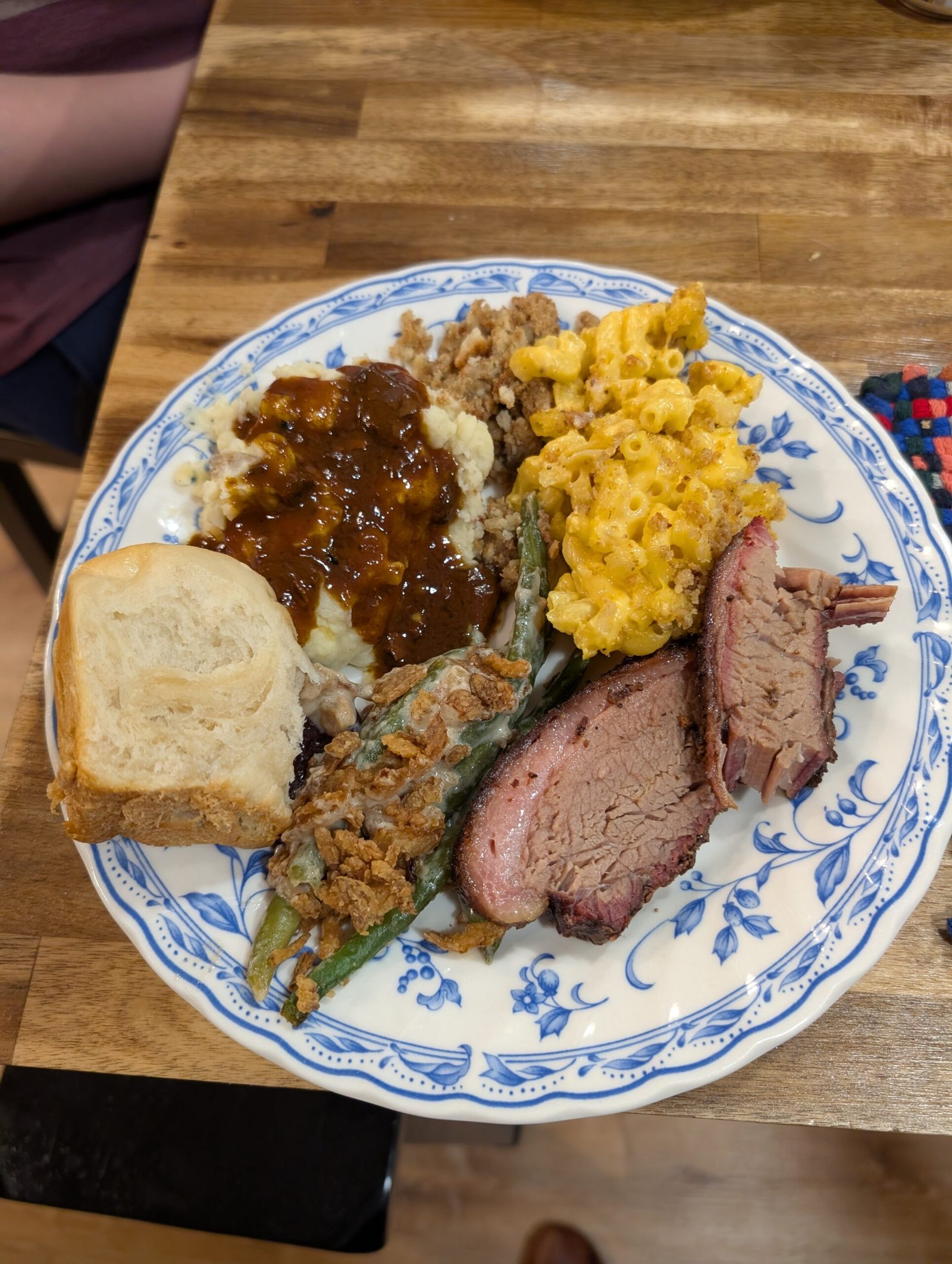 A very full Thanksgiving plate – brisket, mashed potatoes, stuffing, green beans, and more